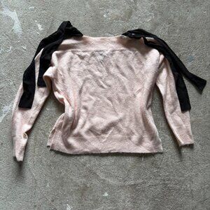Pink and black bow tie off shoulder sweater